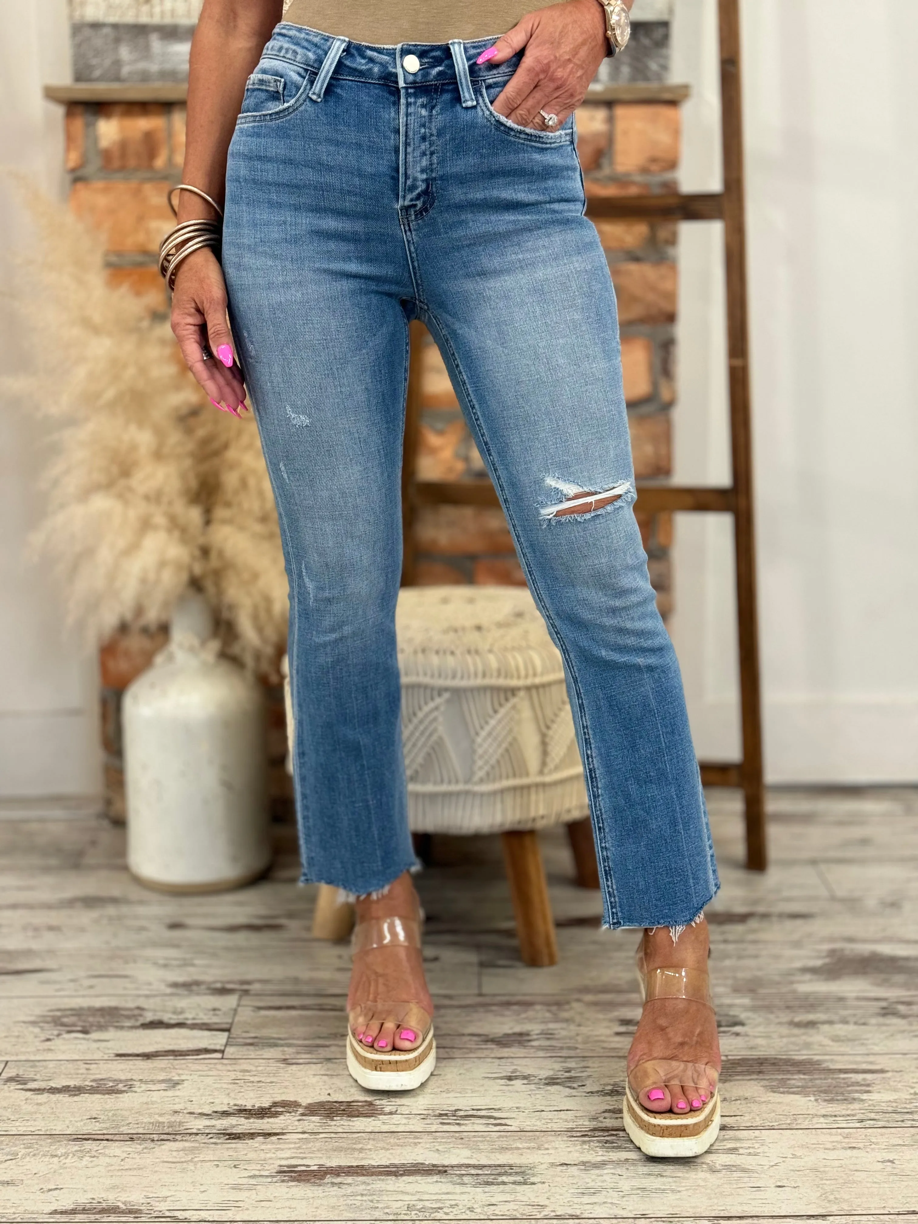 High Rise Asymmetric Hem Kick Flare Jeans